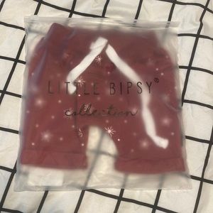 Little Bipsy star harem shorts in red. Size 3-6 months